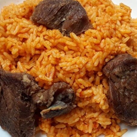 JOLLOF RICE WITH PLANTAIN SERVED WITH BEEF/CHICKEN ASSORTED MEAT/FISH